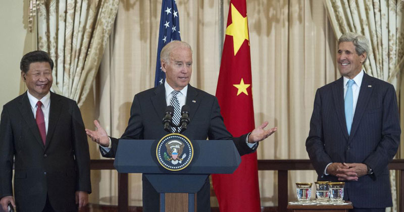 Chinese President Xi Jinping and then-U.S. Secretary of State John Kerry listen as then-U.S. Vice President Joe Biden speaks during a luncheon hosted by Kerry on September 25, 2015 in Washington, D.C. (Photo: Paul J. Richards/AFP via Getty Images) 
